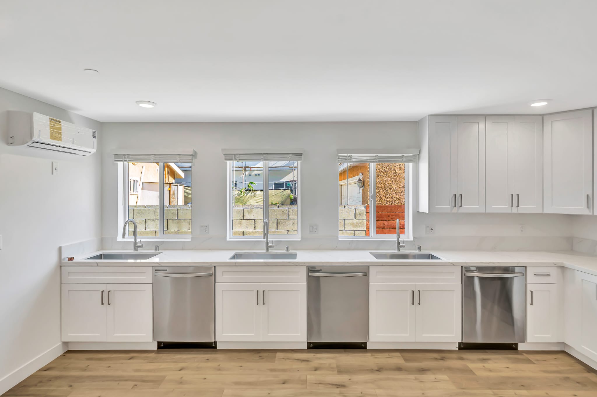 Three sinks and dishwashers